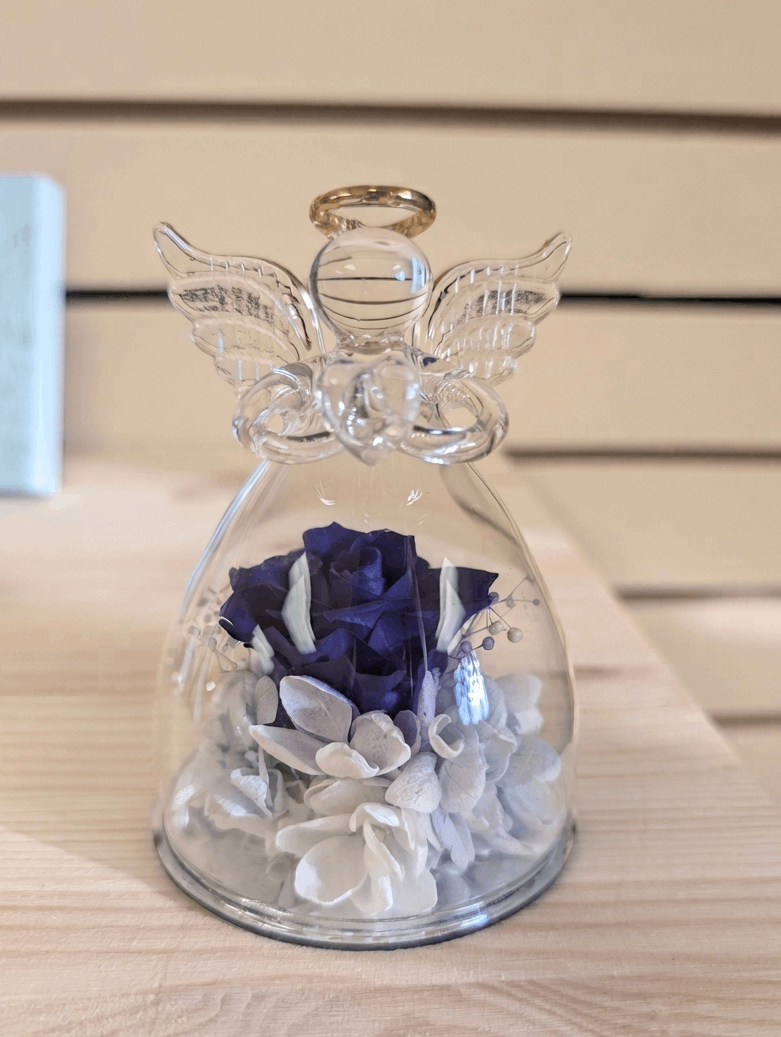 Glass angel with a flower