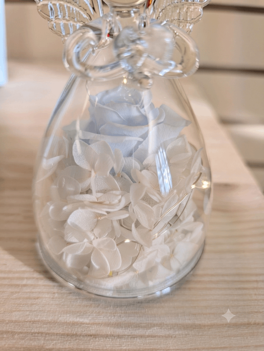 Glass angel with a flower