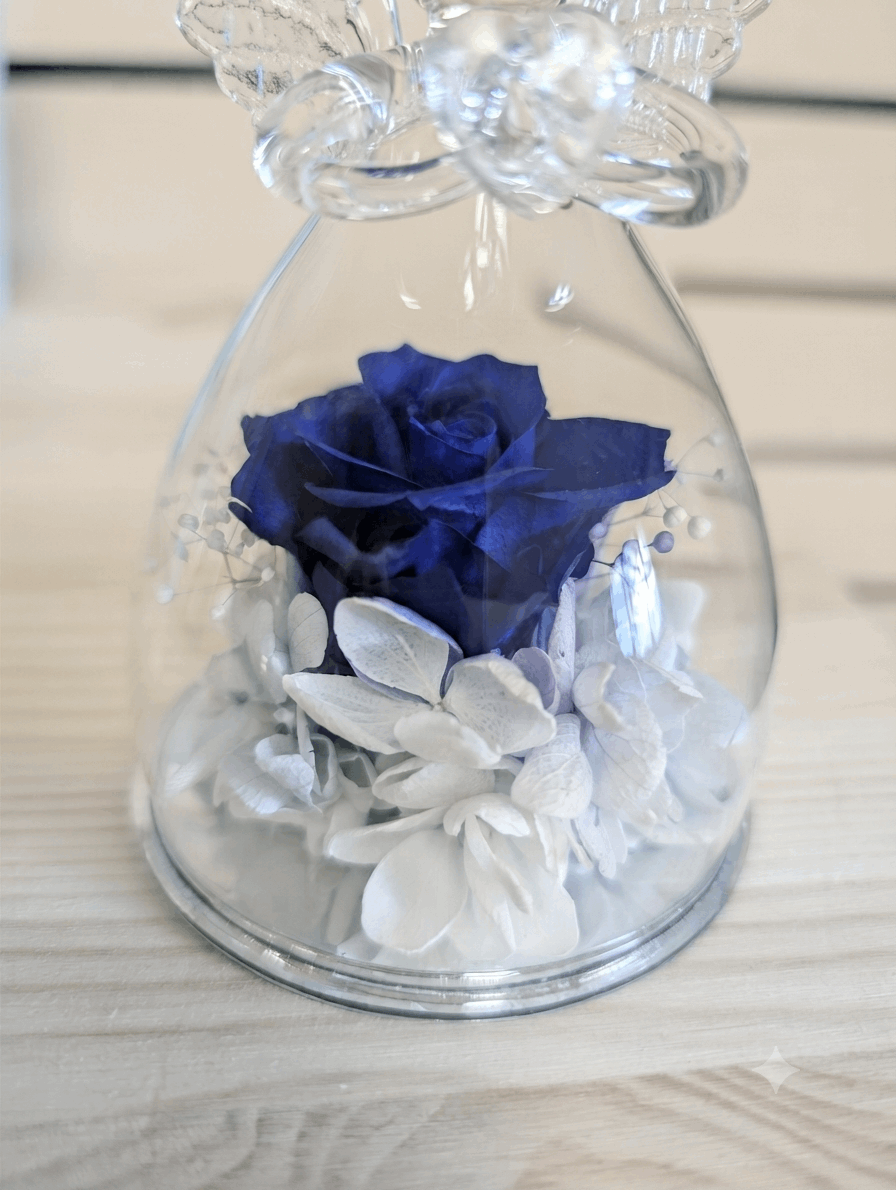 Glass angel with a flower
